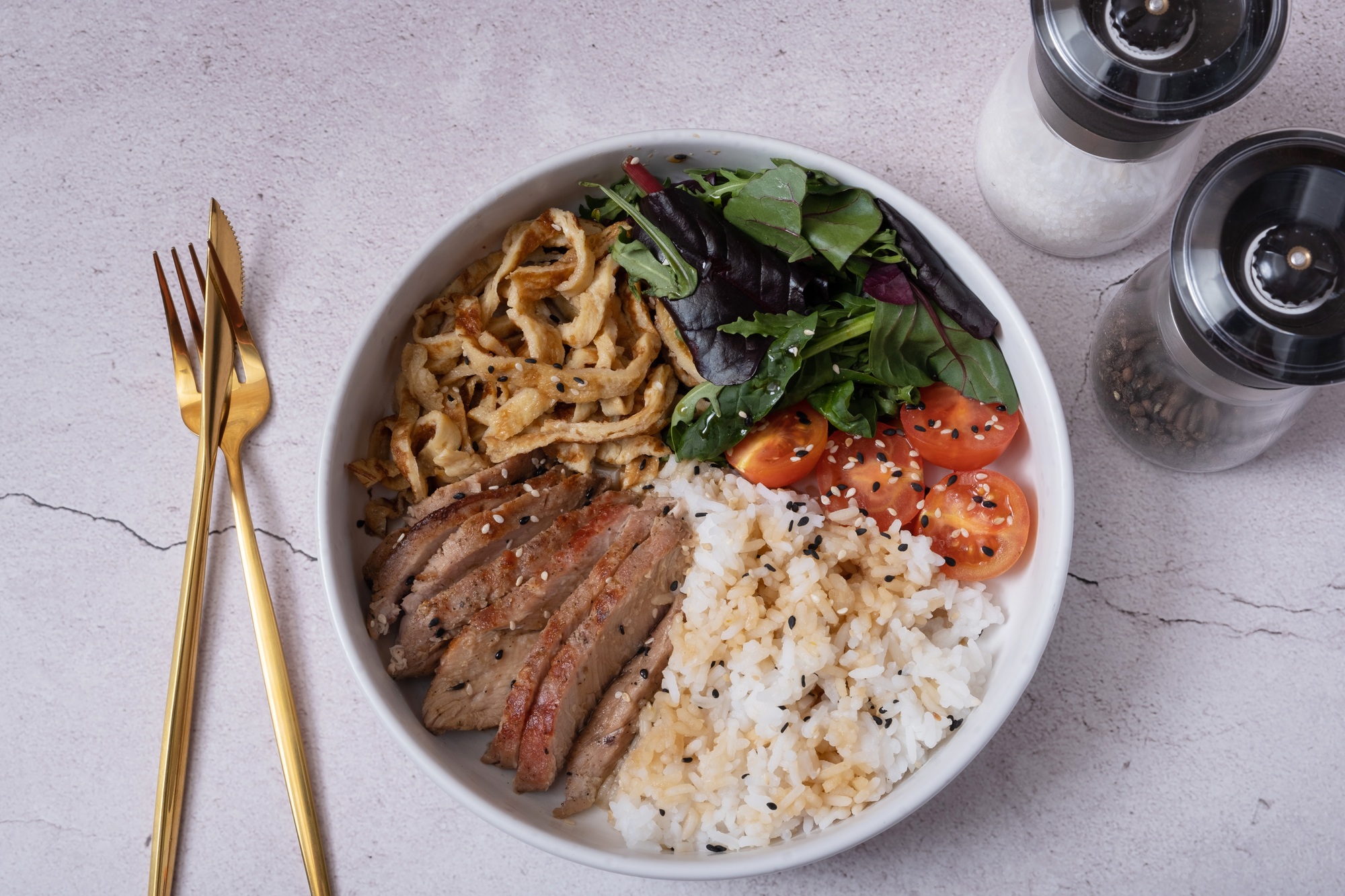 Bowl with rice, veal and vegetables. Balanced nutrition concept.